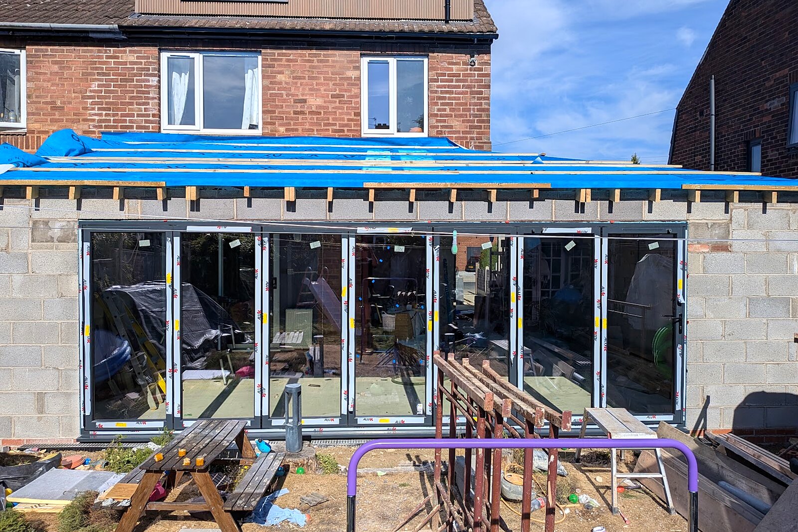 Rear extension with new roof deck and full-width aluminium bifold doors installed