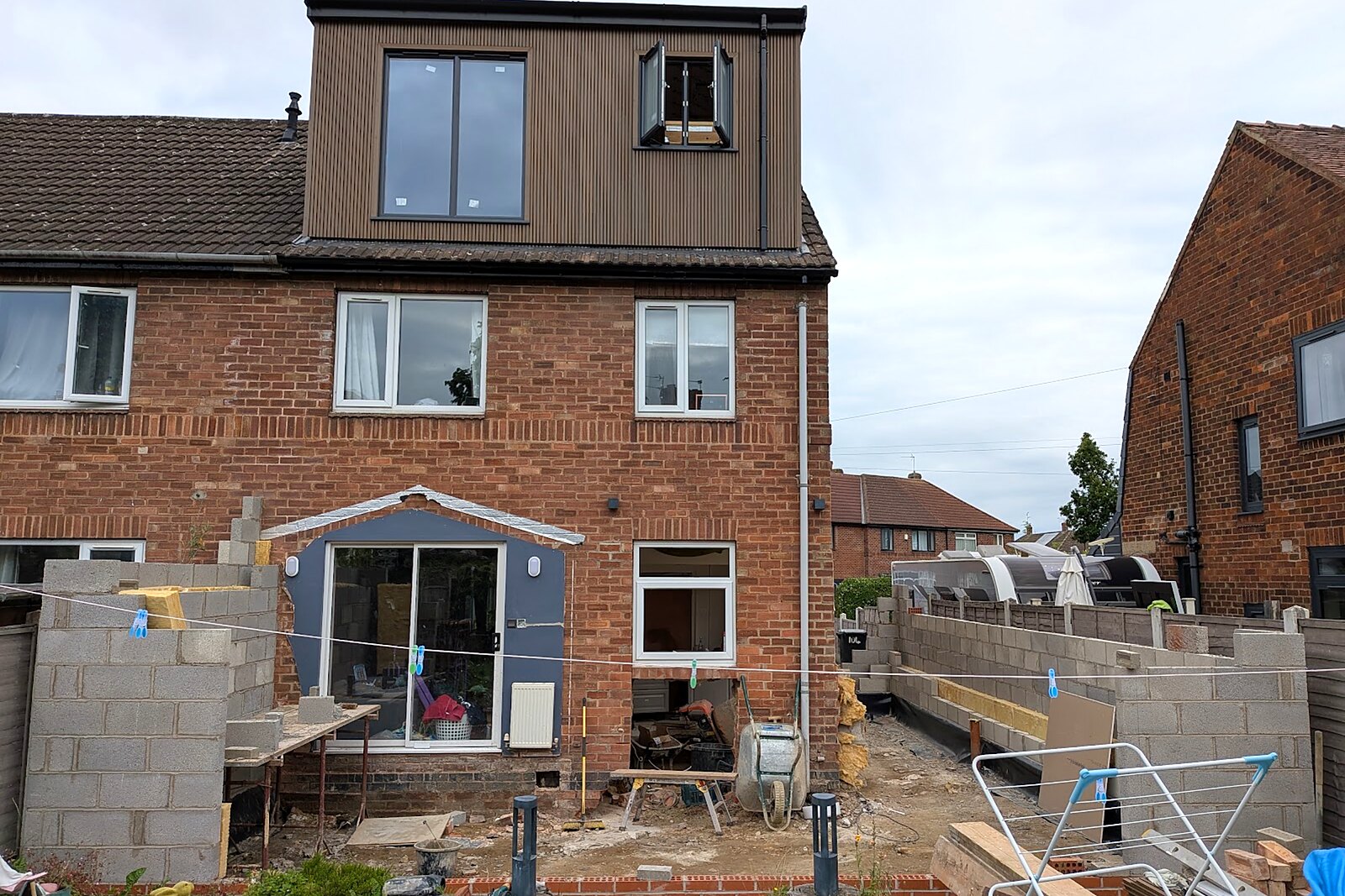 Rear elevation of the house showing the dormer loft conversion above the new extension