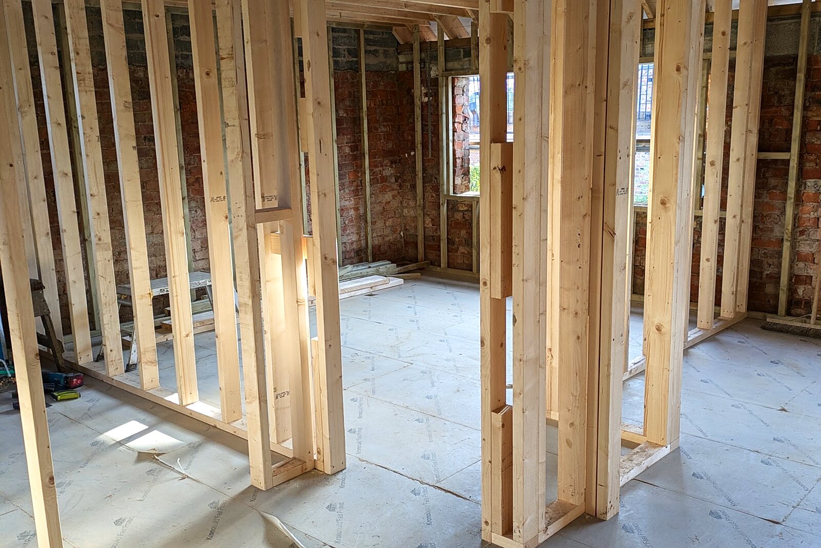Timber stud partition walls forming rooms inside the renovated house